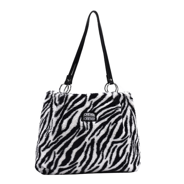 Naiste loomamustri ja nahast sangadega sulukott