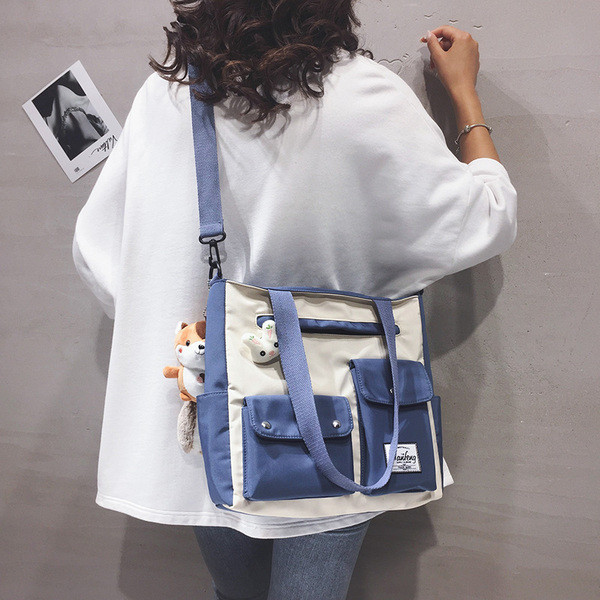 Uue mudeli taskutega naiste tekstiilist kott