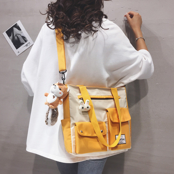 Uue mudeli taskutega naiste tekstiilist kott