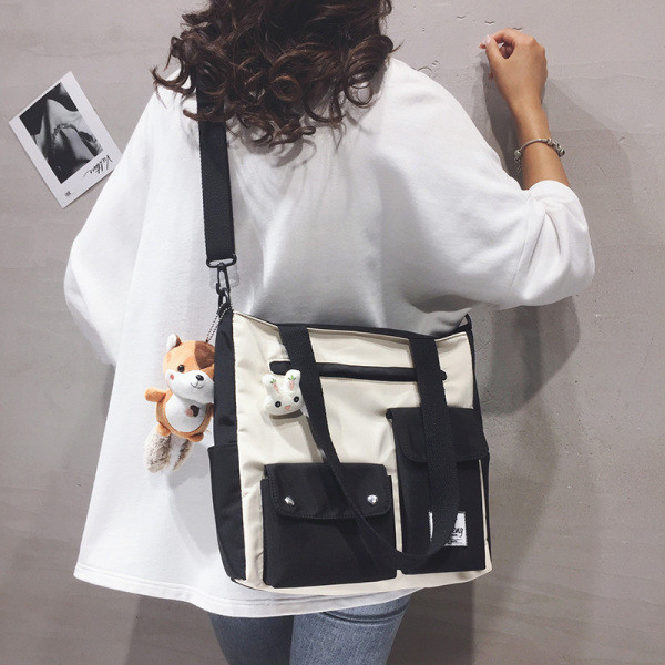 Uue mudeli taskutega naiste tekstiilist kott