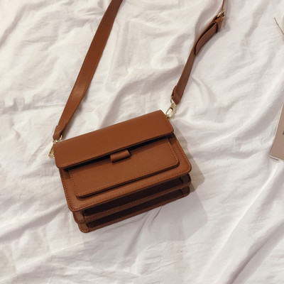 Modern női táska eko bőrből, hosszú füllel