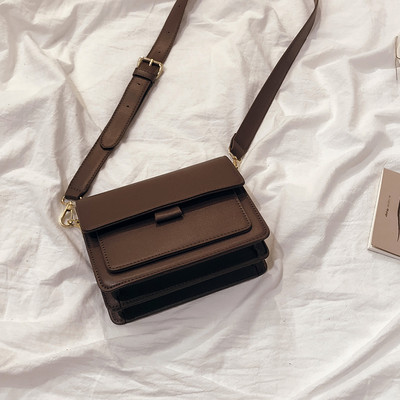 Modern női táska eko bőrből, hosszú füllel