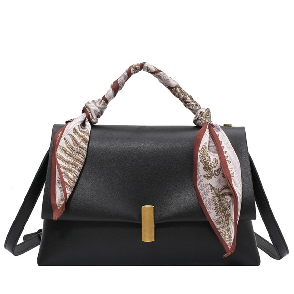 Elegantna ženska torba s metalnom kopčom i vrpcom u boji
