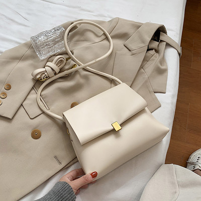 Kaasaegne pika õhukese sangaga ökonahast naistekott