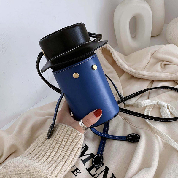 Eko bőrből készült modern női táska hosszú füllel, 3D elemekkel