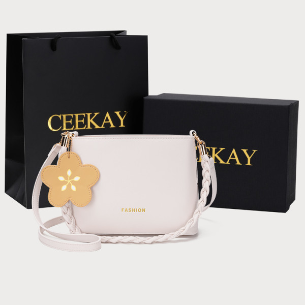 Modern női táska medállal és cipzárral