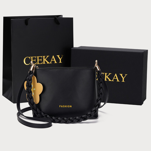 Modern női táska medállal és cipzárral