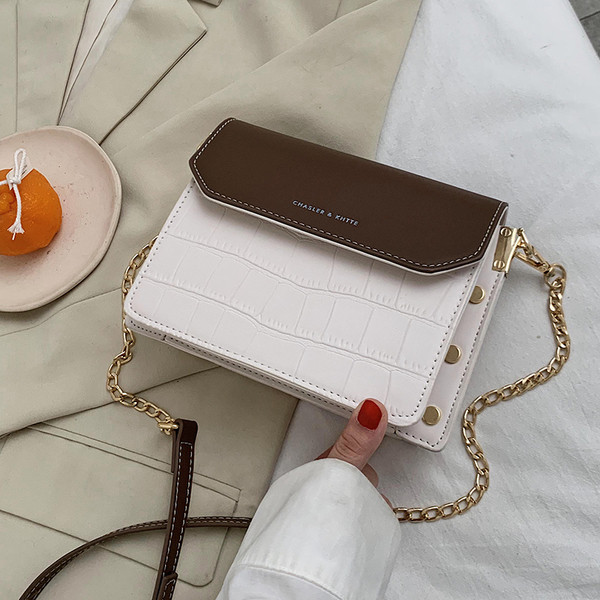 Uue mudeli ajakohane metallelementidega naistekott