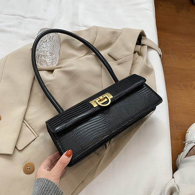 Új modell női bőrtáska fém rögzítéssel és bőr fogantyúval