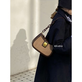 Kis bőrtáska fém díszítéssel