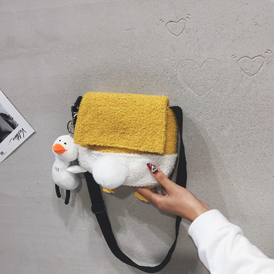 Väike mitmes värvitoonis suleline õlakott