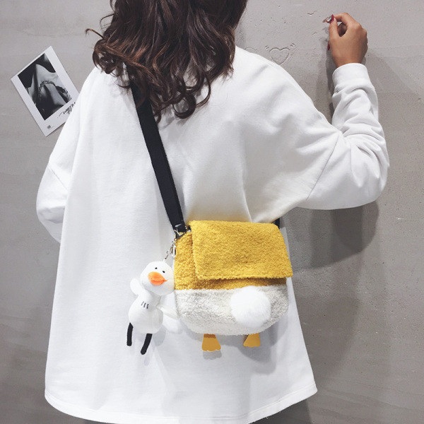 Väike mitmes värvitoonis suleline õlakott