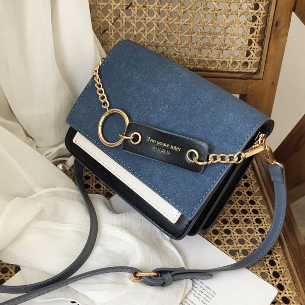 Modern női táska öko velúrból, fém elemmel