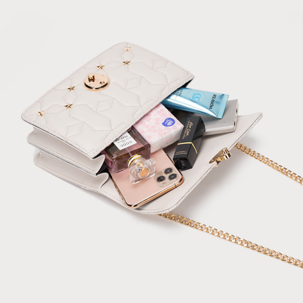 Stiilne naiste nahast kott metallist elementidega