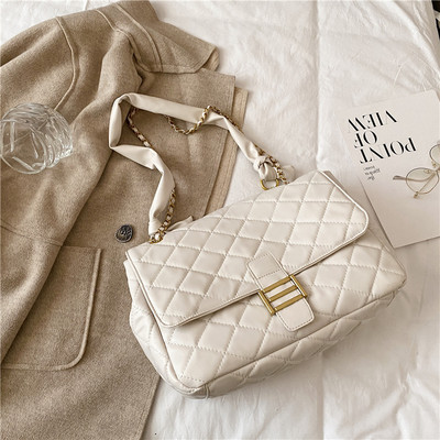 Ženska kožna torba sa metalnom kopčom