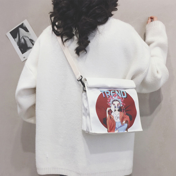 Női táska színes mintával és hosszú füllel