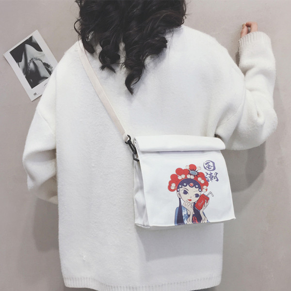 Női táska színes mintával és hosszú füllel