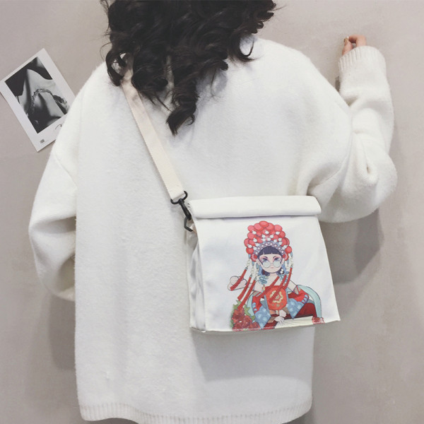 Női táska színes mintával és hosszú füllel