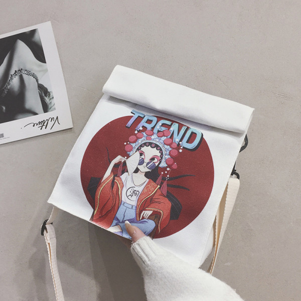 Női táska színes mintával és hosszú füllel