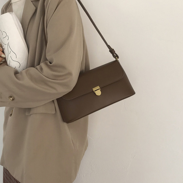 Väike ristkülikukujuline ühe sangaga ökonahast kott