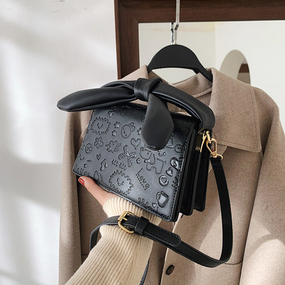 Elegantna torbica s vrpcom i dugom ručkom