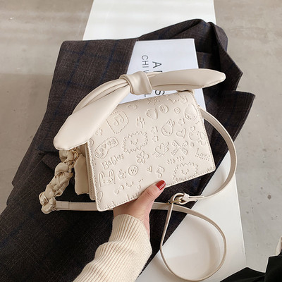 Elegantna torbica s vrpcom i dugom ručkom