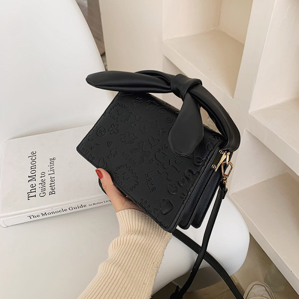 Elegantna torbica s vrpcom i dugom ručkom