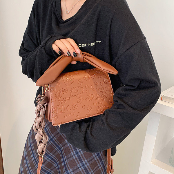 Elegantna torbica s vrpcom i dugom ručkom