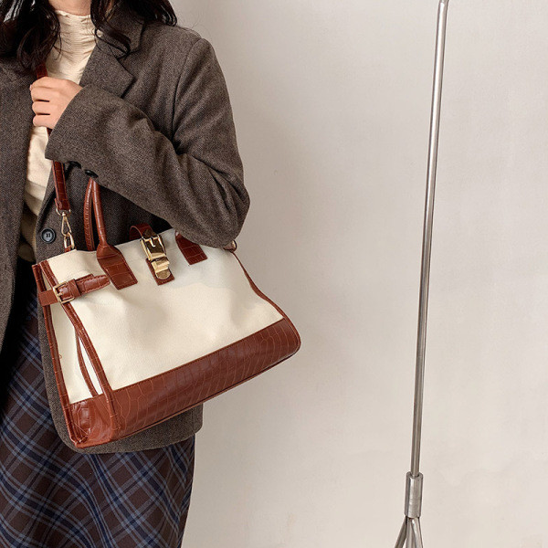 Retro stiilis lühikeste ja pikkade sangadega naistekott