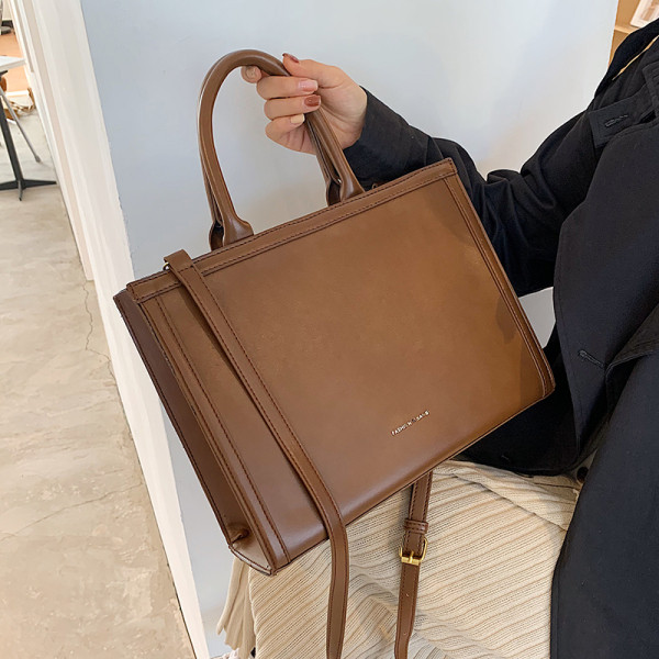 Modern bőr kézitáska hosszú és rövid fogantyúval