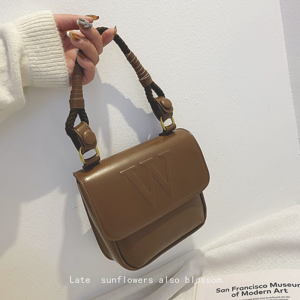 Kahes värvitoonis neetidega naistekott tavaline mudel