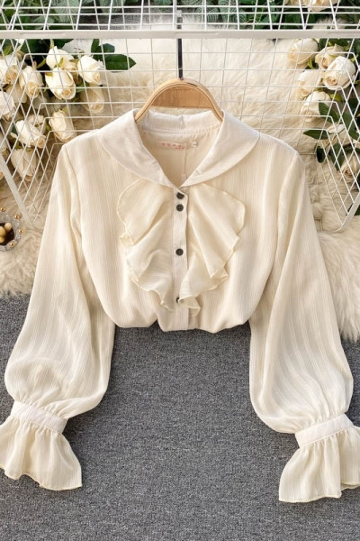 Stílusos női ing bézs színű gombokkal