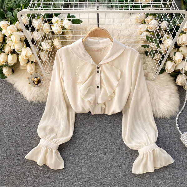 Stílusos női ing bézs színű gombokkal