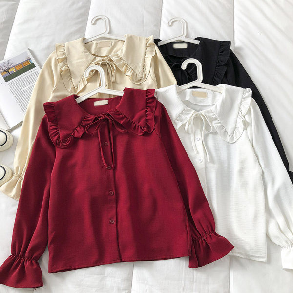 Korszerű női ing kerek nyakkivágással és gombokkal