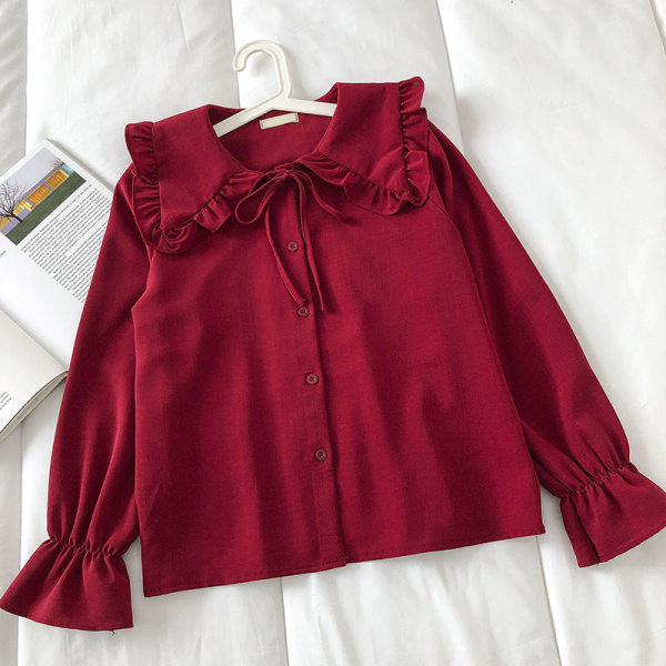 Korszerű női ing kerek nyakkivágással és gombokkal