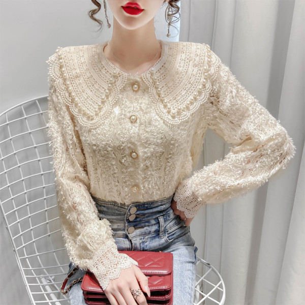 Naiste vabaaja särk nööpide ja tikanditega