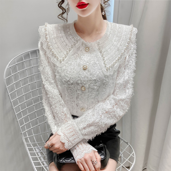 Naiste vabaaja särk nööpide ja tikanditega