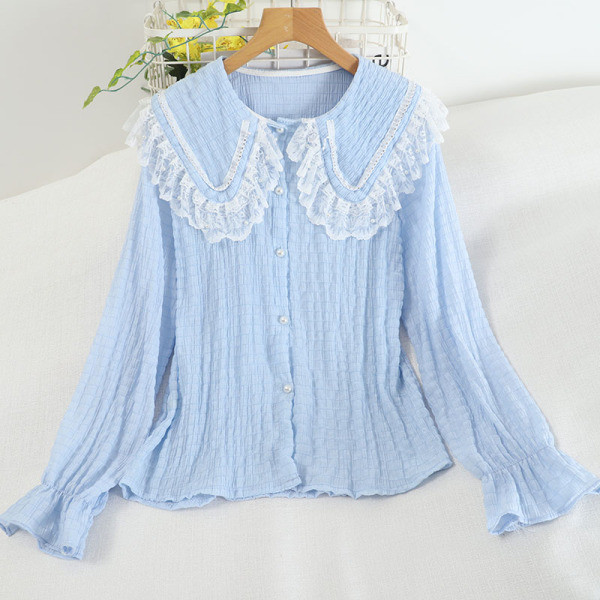 Pitsilise ja pikkade varrukatega naiste särk