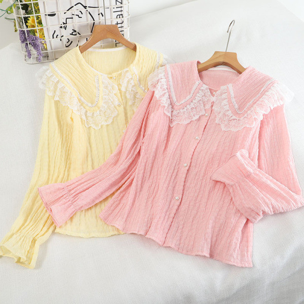 Pitsilise ja pikkade varrukatega naiste särk