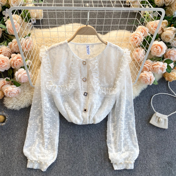 Moderna ženska košulja s perlama i gumbima