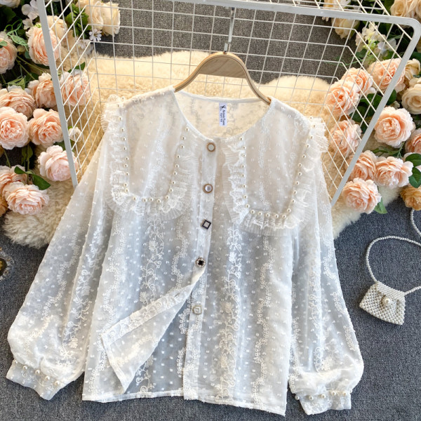 Moderna ženska košulja s perlama i gumbima
