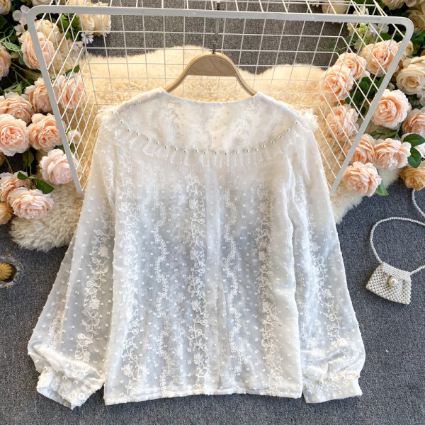 Moderna ženska košulja s perlama i gumbima