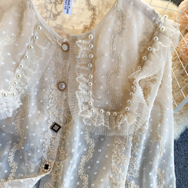 Moderna ženska košulja s perlama i gumbima