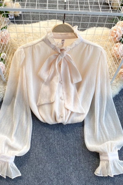 Erős női ing szalaggal és gombokkal