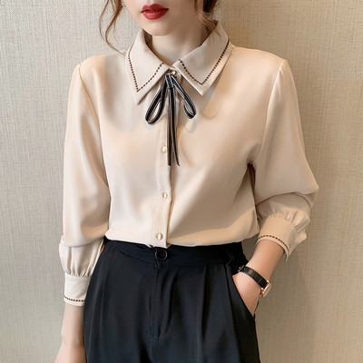 Ajakohane lipsude ja nööpidega naiste särk