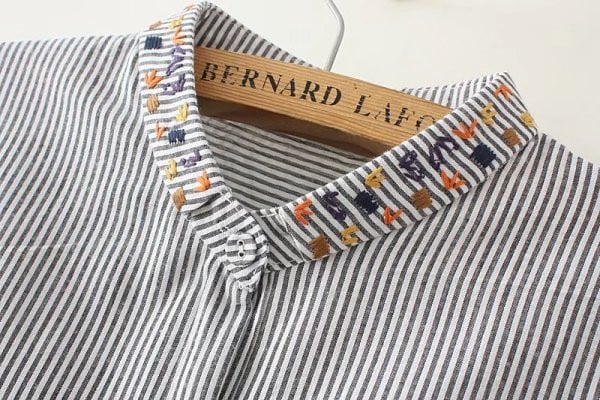 Uue mudeli tikandiga ja spits-kaelusega naistesärk