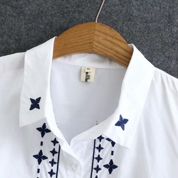 Tikandite ja pikkade varrukatega naiste särk