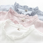 Női alkalmi ing gombokkal és fürtökkel