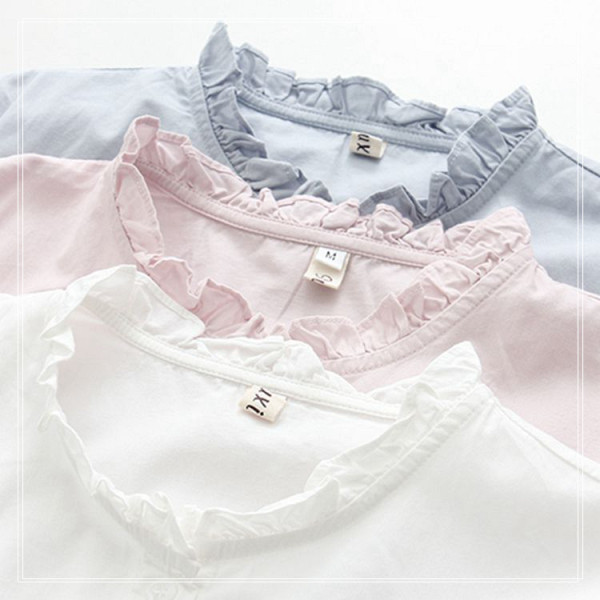 Női alkalmi ing gombokkal és fürtökkel