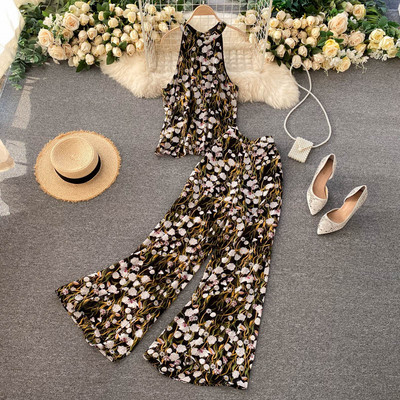 Värviline naiste ülikond koos pükste ja topiga